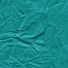 Blue vintage and old looking crumpled paper background. Retro cardboard texture. Grunge paper for drawing. Ancient book page. Present wrapping.