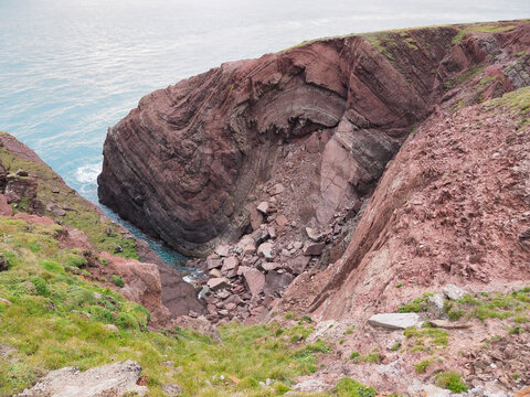 Cobblers Hole, St. Anns Head, and the splendid anticline and syncline fold couplet in the Devonian-age Old Red Sandstone rock, south Pembrokeshire coast, Wales, UK