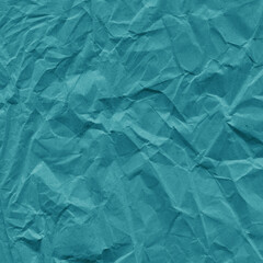 Blue vintage and old looking crumpled paper background. Retro cardboard texture. Grunge paper for drawing. Ancient book page. Present wrapping.