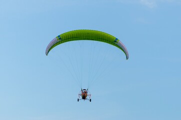 Paraglider flying free in the sky