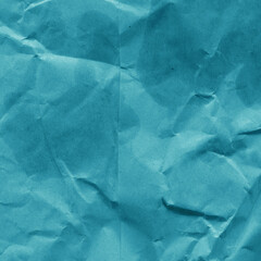 Blue vintage and old looking crumpled paper background. Retro cardboard texture. Grunge paper for drawing. Ancient book page. Present wrapping.