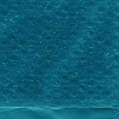 Blue vintage and old looking crumpled paper background. Retro cardboard texture. Grunge paper for drawing. Ancient book page. Present wrapping.