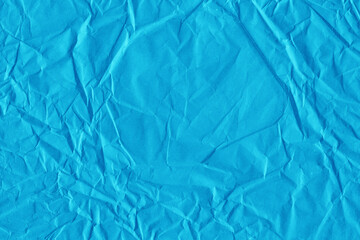 Obraz premium Blue vintage and old looking crumpled paper background. Retro cardboard texture. Grunge paper for drawing. Ancient book page. Present wrapping.