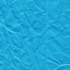 Blue vintage and old looking crumpled paper background. Retro cardboard texture. Grunge paper for drawing. Ancient book page. Present wrapping.