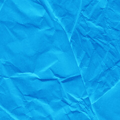 Blue vintage and old looking crumpled paper background. Retro cardboard texture. Grunge paper for drawing. Ancient book page. Present wrapping.