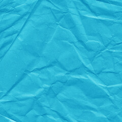 Blue vintage and old looking crumpled paper background. Retro cardboard texture. Grunge paper for drawing. Ancient book page. Present wrapping.
