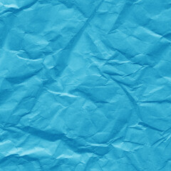 Blue vintage and old looking crumpled paper background. Retro cardboard texture. Grunge paper for drawing. Ancient book page. Present wrapping.
