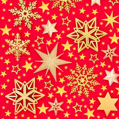 Naklejka na ściany i meble Gold star & snowflake Christmas background on red, abstract Composition for Xmas, New Year & holiday season. Flat lay top view.