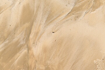The texture of the sand by the ocean