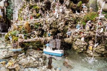 Little boat on Nativity scene in fountain on Amalfi Traditional Neapolitan nativity scene, Amalfi, Italy,
