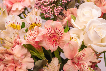 Bouquet of  soft pink flowers in wrapping paper.