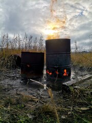 Fire in an old barrel on the street.