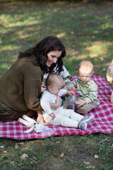 Fototapeta premium mom with three children