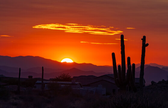 Vibrant Orange Desert Sunset Skies With Sun Setting Near Phoenix, AZ