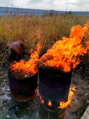 Fire in an old barrel on the street.