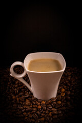 Obraz premium Cup of Coffee on Black Background