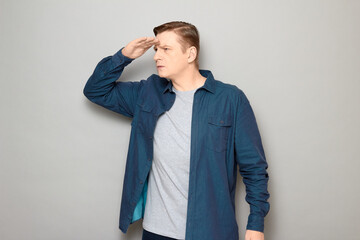 Portrait of serious focused man gazing into the distance