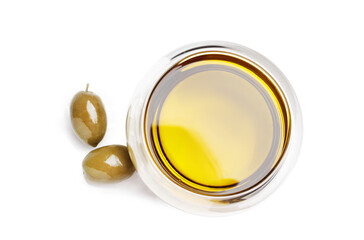Bowl of fresh olive oil and green olives with leaves isolated on white background. View from above