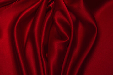 Fototapeta na wymiar Red silk or satin luxury fabric texture can use as abstract background.