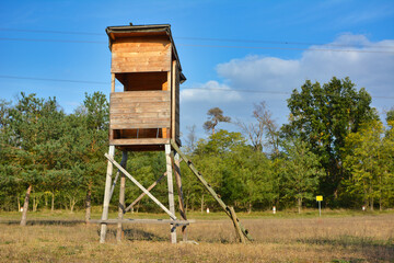 Wooden tower dear stand as vantage point for hunters