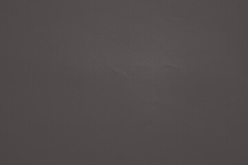 Bare concrete wall with dark gray background