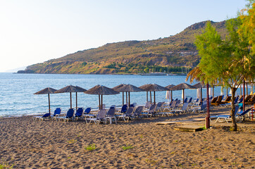 Beach with umbrellas, Lesbos, Greece - 386471760