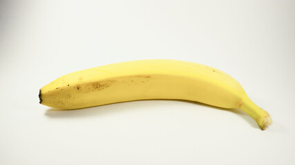 Yellow ripe banana on white background. Single banana isolated. 
