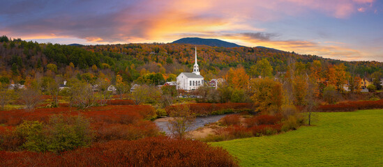 Panorama of Stowe Church in Vermont surrounded by the beautiful fall foliage - obrazy, fototapety, plakaty