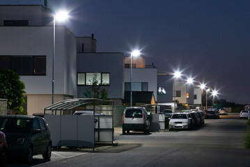 modern street with apartment building and led street lights