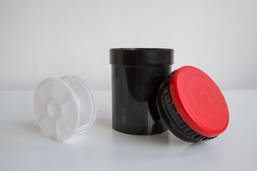 Dark room equipment: developing tank, self winding reel for 35mm and medium format film on white...