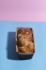 Sweet bread on blue background. Minimal concept.
