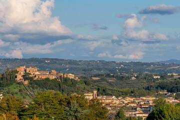 Fototapeta na wymiar Panoramic view of Certaldo lit by the late afternoon sun, against a beautiful sky, Tuscany, Italy