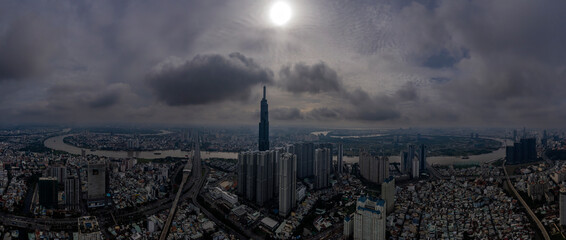 Ho Chi Minh city panorama from drone with modern skyline, dramatic sky and view of Saigon river in...