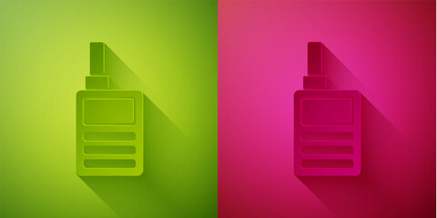 Paper cut Baby Monitor Walkie Talkie icon isolated on green and pink background. Paper art style. Vector.