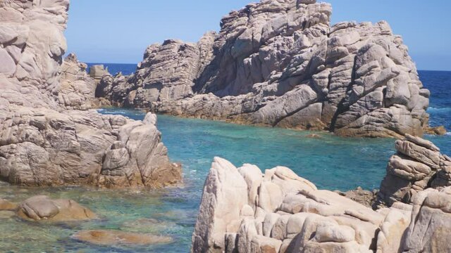 Beautiful shot of rock formations near the sea close to Beach Calarossa, Sardinia, Italy.