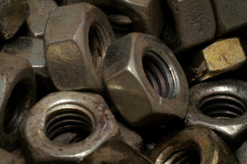 Macro shot stacked of dusty nuts in the workshop