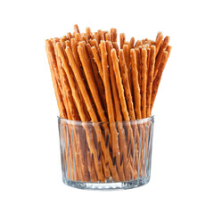 Snack breadsticks in a glass vase. Isolated on white background.