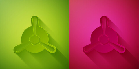Paper cut Plane propeller icon isolated on green and pink background. Vintage aircraft propeller. Paper art style. Vector.