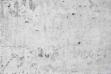 Texture of a concrete wall with cracks and scratches which can be used as a background