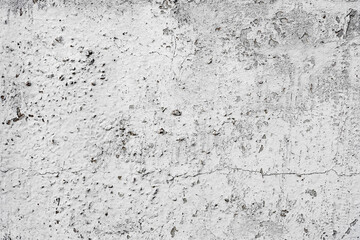 Texture of a concrete wall with cracks and scratches which can be used as a background
