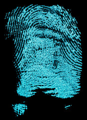 Fingerprint with ultraviolet lamp. Fingerprint on a black background. Concept of crime scene.