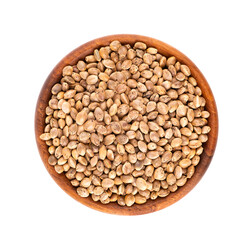 Fototapeta premium Hemp seeds isolated on white background. Dry seeds of cannabis, hemp or marijuana in wooden bowl. Top view.