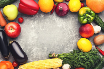 Ripe fruits and vegetables on wooden table