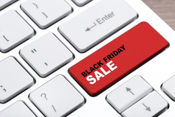Fototapeta premium Background of new computer keyboard with text Black Friday Sale
