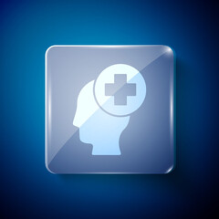 White Male head with hospital icon isolated on blue background. Head with mental health, healthcare and medical sign. Square glass panels. Vector.