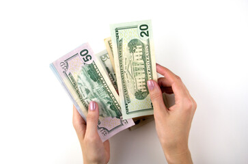 Women's hands count money. Woman's hand recount bundle of dollars
