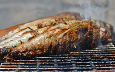Obraz na płótnie Canvas Grilled mackerel fish. Fatty, oily fish is an excellent and healthy source of DHA and EPA, which are two key types of omega-3 acid. Barbecue with fish. 