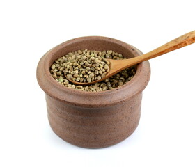 Hemp seeds in a bowl isolated on white background. Super food hemp seed. Cannabis Hemp seeds close up.