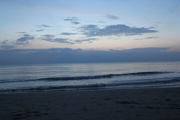 Fototapeta na wymiar horizontal line of deep blue calm sky and sea after sunset on a beach in thailand