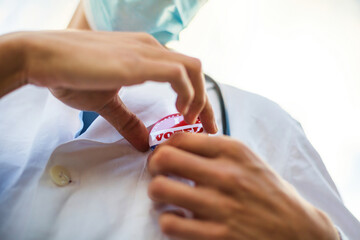 Doctor with I voted today badge on his uniform.